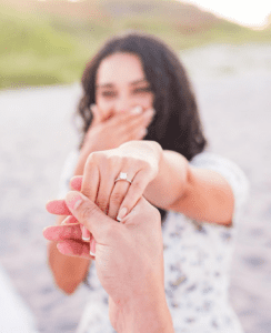 engagement ring hand holding